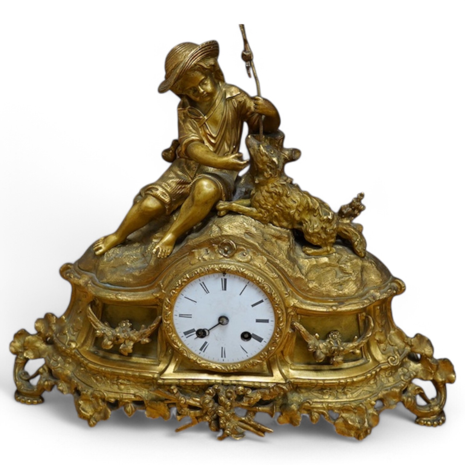 An early 20th century French ormolu clock surmounted with a boy and dog, striking on a bell, 41cm wide. Condition - fair, one hand missing, untested